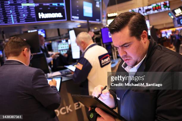 Traders work on the floor of the New York Stock Exchange during morning trading on November 02, 2022 in New York City. Stocks opened low this morning...