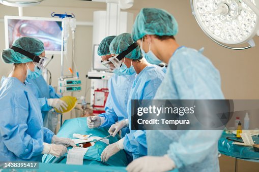 Surgical Staff Working Together During A Medical Procedure In Fully ...