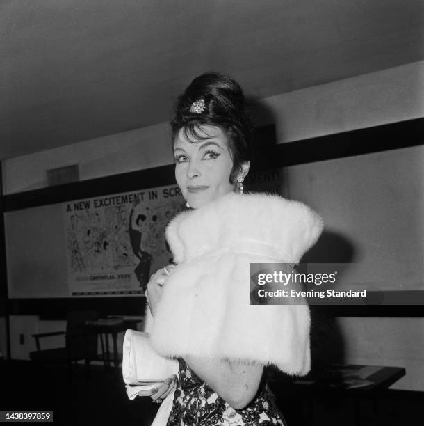 French-British actress Yvonne Furneaux wearing a mink stole at the London premiere of 'La Dolce Vita', a film in which she stars, in September 1960.