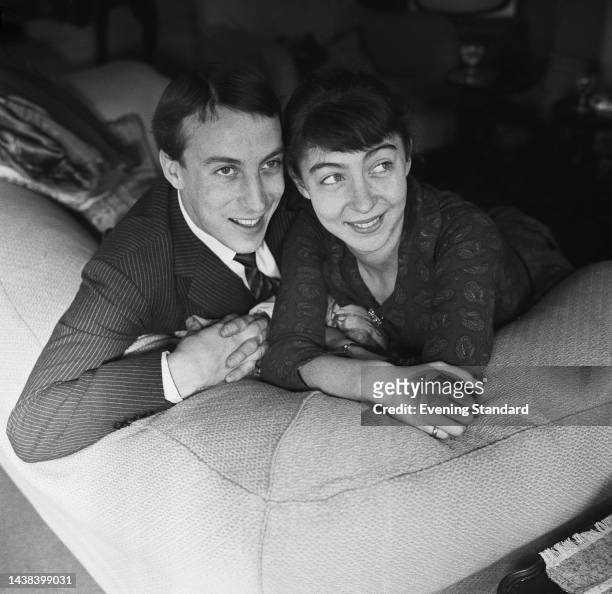 Scottish actor Ian Richardson and English actress Maroussia Frank relaxing side by side on a sofa on January 10th, 1961.