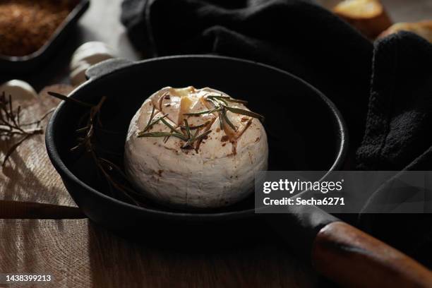 baked camembert cheese with garlic, rosemary and honey - paprika stock pictures, royalty-free photos & images