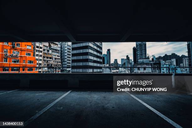 interior of parking garage with car and vacant parking lot in parking building - night city stock pictures, royalty-free photos & images