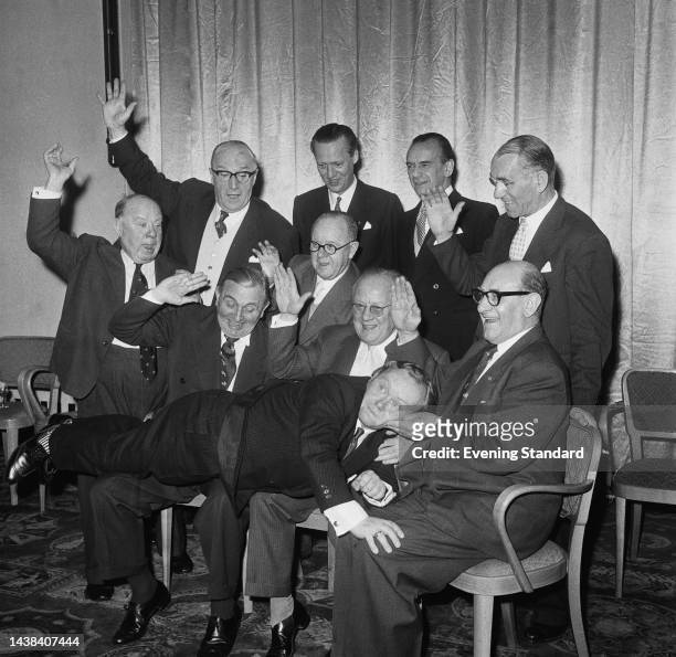 British entertainers including members of the 'Crazy Gang' variety act and friends posing for a humorous picture on December 29th, 1960. They are...