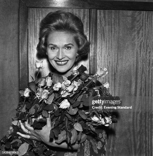German-born soprano Elisabeth Schwarzkopf holding a bouquet of roses, October 18th, 1961.