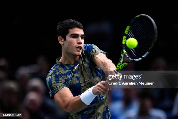 Carlos Alcaraz of Spain plays a backhand during his men's single second round match against Yoshihito Nishioka of Japan during Day three of the Rolex...