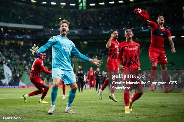 Kevin Trapp and Tuta of Frankfurt celebrating victory after the UEFA Champions League group D match between Sporting CP and Eintracht Frankfurt at...