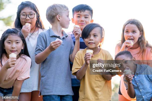 kids eating ice cream - filipino family eating stock pictures, royalty-free photos & images