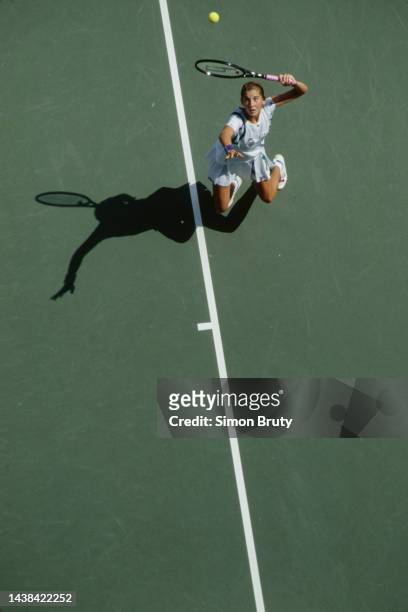 Monica Seles from Yugoslavia keeps her eyes on the tennis ball as she serves to Shaun Stafford of the United States during their Women's Singles...