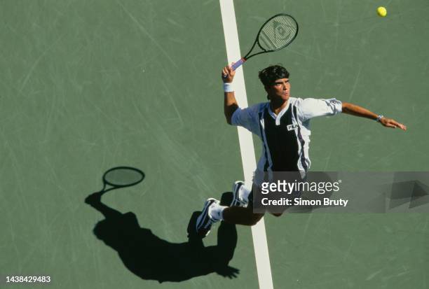 Mark Philippoussis from Australia keeps his eyes on the tennis ball as he serves to Andrei Olhovskiy of Russia during their Men's Singles Second...