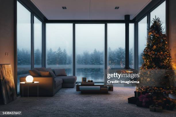 christmas celebration at luxury lake house - chalet stockfoto's en -beelden
