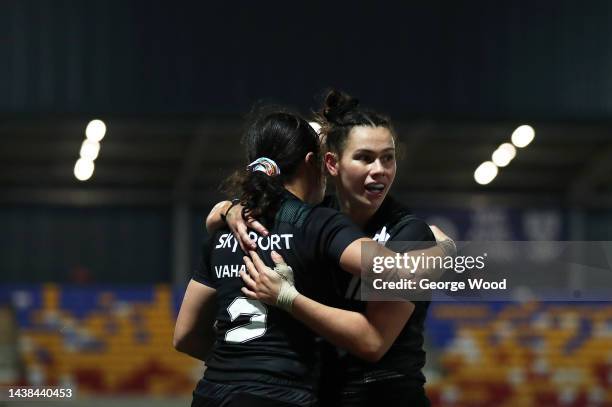 Katelyn Vaha’akolo of New Zealand celebrates with teammate Shanice Parker after scoring their team's seventh try during the Women's Rugby League...