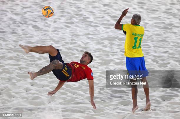 Francisco Sanchez Serrano of Spain takes a shot at goal as Mauricio Pereira Braz De Oliveira of Brazil attempts to block during the Emirates...