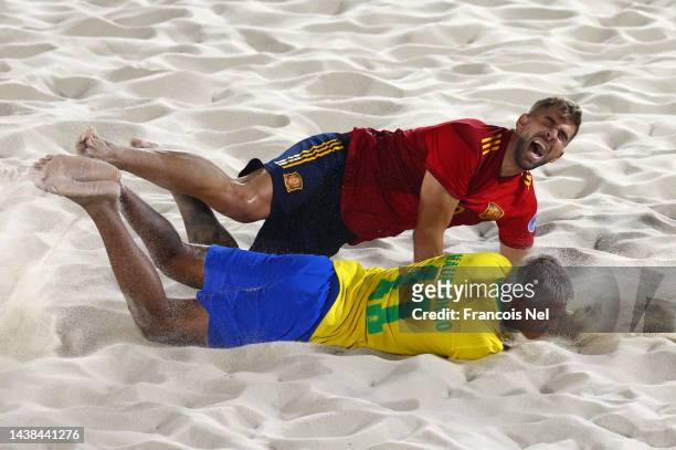 Francisco Sanchez Serrano of Spain collides with Mauricio Pereira Braz De Oliveira of Brazil during the Emirates Intercontinental Beach Soccer Cup...