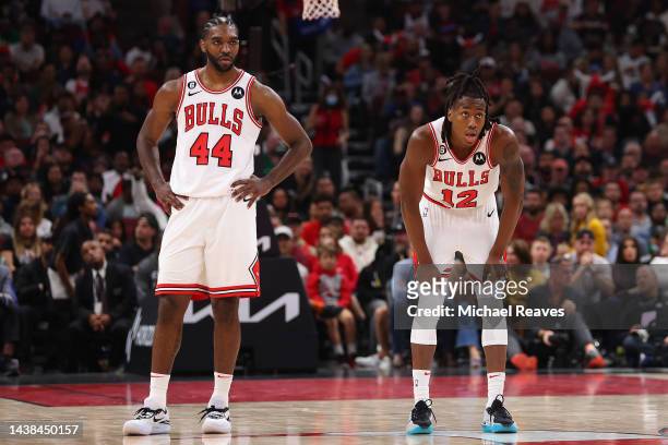 Patrick Williams and Ayo Dosunmu of the Chicago Bulls looks on against the Boston Celtics during the second half at United Center on October 24, 2022...