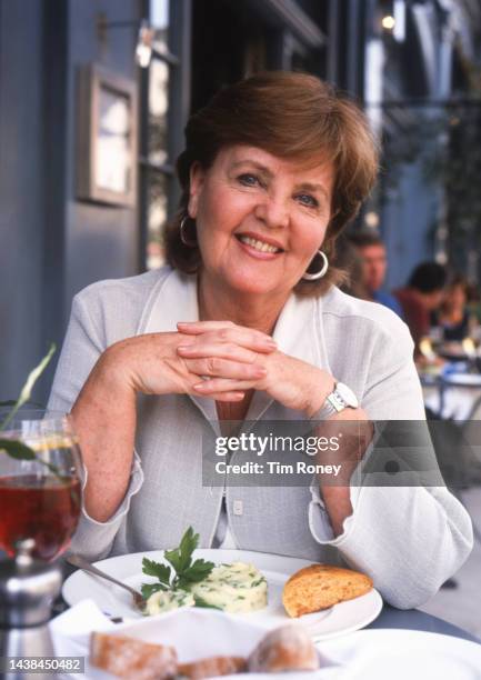 Portrait of British actress Pauline Collins as she sits at unspecified sidewalk cafe, United Kingdom, circa 2000.