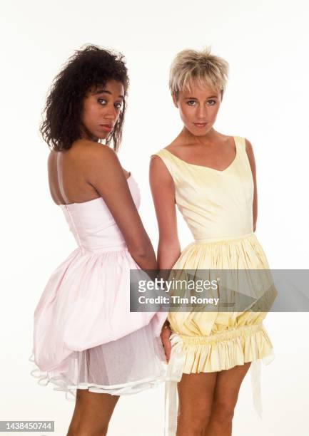 Portrait of British Pop singers Helen DeMacque and Shirlie Holliman, who perform as Pepsi & Shirlie, as they pose against a white background, circa...