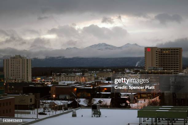 Mountain range stands above downtown at sunrise after the city received overnight snow on November 02, 2022 in Anchorage, Alaska. Early and absentee...