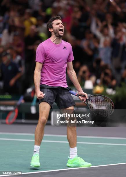 Gilles Simon of France celebrates winning match point in their round of 32 singles match against Taylor Fritz of the United States during Day Three...