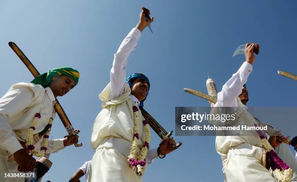 Yemenis dance while celebrating their wedding ceremony in a collective wedding on October 31, 2022 in Sana'a, Yemen.