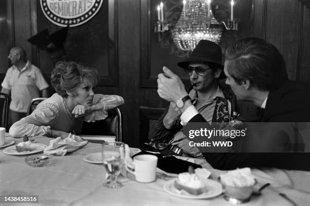 Barbara Harris, director Jerry Schatzberg, and Alan Alda prepare for filming during production of "The Seduction of Joe Tynan" in Baltimore,...