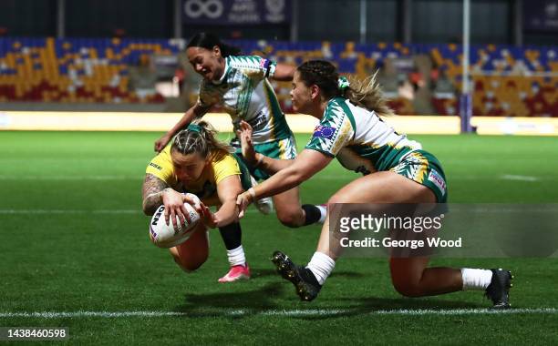 Julia Robinson of Australia touches down for their team's seventh try during the Women's Rugby League World Cup 2021 Pool B match between Australia...