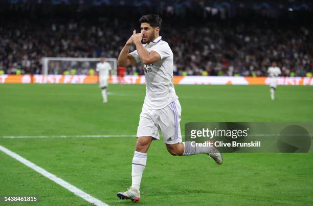 Marco Asensio of Real Madrid celebrates after scoring their sides third goal during the UEFA Champions League group F match between Real Madrid and...