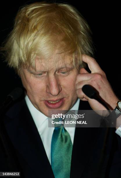 Boris Johnson speaks to the media after being elected for a second consecutive term as London mayor at City Hall in central London on May 4, 2012....