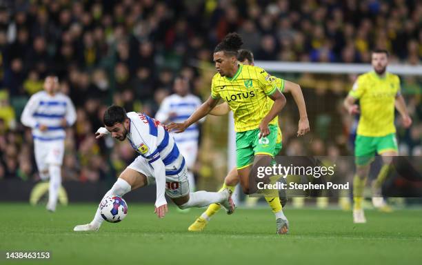 Sam McCallum of Norwich City battles for possession with Ilias Chair of Queens Park Rangers during the Sky Bet Championship between Norwich City and...