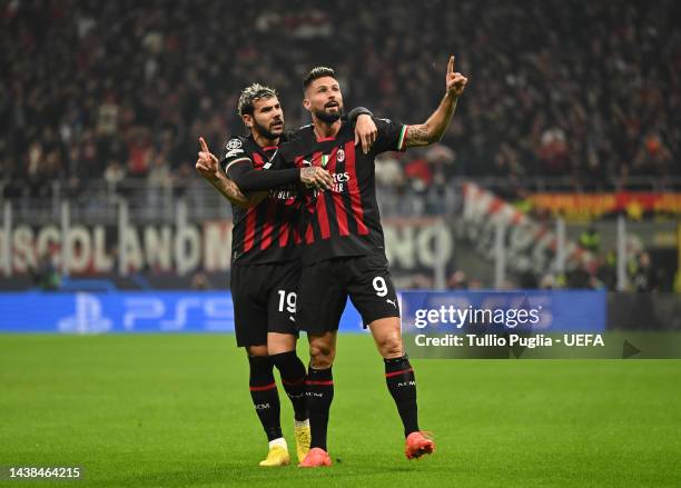 Olivier Giroud celebrates with Theo Hernandez of AC Milan after scoring their team's first goal during the UEFA Champions League group E match...