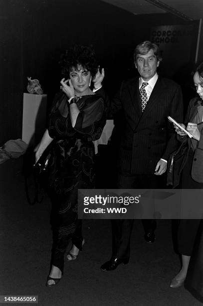 Elizabeth Taylor and John Warner attend a party, following a performance of the play "The Little Foxes," at the Kennedy Center in Washington, D.C.,...