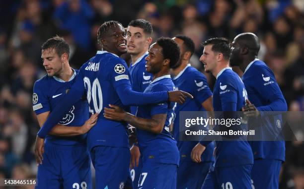 Denis Zakaria celebrates with Raheem Sterling of Chelsea after scoring their team's second goal during the UEFA Champions League group E match...