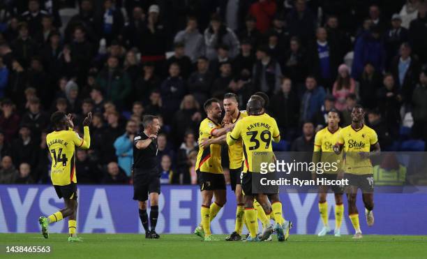 Francisco Sierralta of Watford celebrates with teammates after scoring their team's first goal during the Sky Bet Championship between Cardiff City...