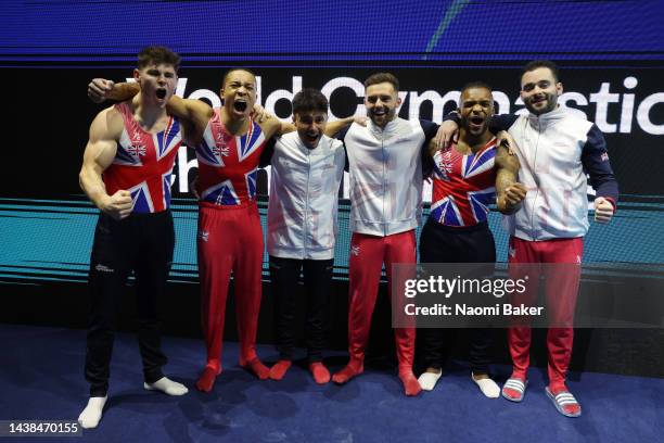 Bronze medalists of Team Great Britain celebrate following the Men's Team Final on day five of the 2022 Gymnastics World Championships at M&S Bank...