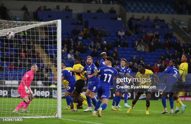 Ismaila Sarr of Watford scores their team's second goal past Ryan Allsop of Cardiff City during the Sky Bet Championship between Cardiff City and...