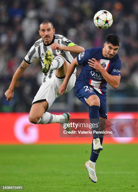 Leonardo Bonucci of Juventus competes for a header with Carlos Soler of Paris Saint-Germain during the UEFA Champions League Group H match between...