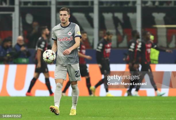 Luka Sucic of FC Salzburg reacts with the match ball after Olivier Giroud of AC Milan scored their sides third goal during the UEFA Champions League...