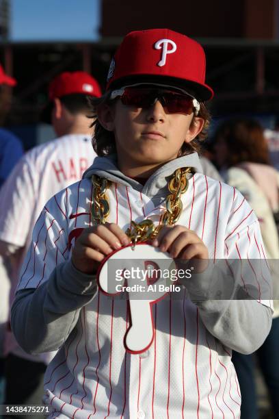 Young fan poses for a photo outside the ballpark prior to Game Four of the 2022 World Series between the Houston Astros and the Philadelphia Phillies...