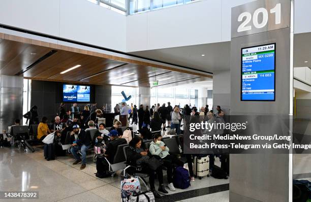 Los Angeles, CA Passengers wait to board Breeze's inaugural flight from LAX to New York's Westchester County, in Los Angeles on Wednesday, November...