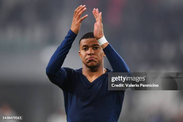 Kylian Mbappe of Paris Saint-Germain applauds fans after the UEFA Champions League Group H match between Juventus and Paris Saint-Germain at Juventus...