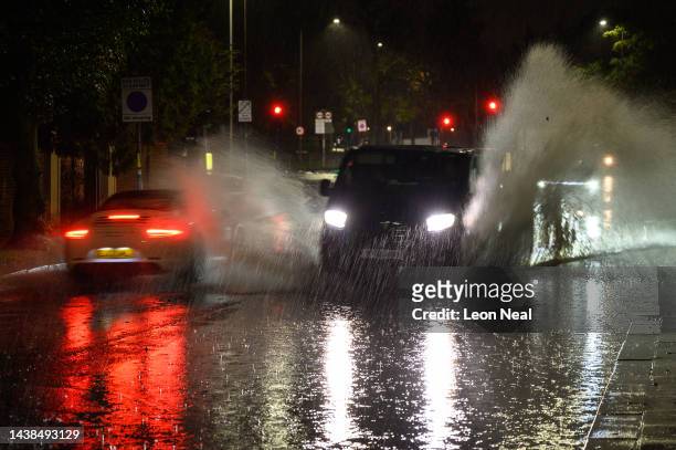 Vehicles negotiate a flooded section of the A1 road on November 02, 2022 in London, England. Torrential rain and flash flooding hit the region late...