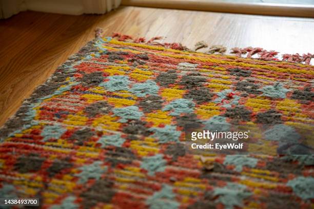 a moroccan carpet laid out in a modern home - moroccan culture stock pictures, royalty-free photos & images