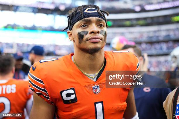 Justin Fields of the Chicago Bears walks off of the field against the Dallas Cowboys at AT&T Stadium on October 30, 2022 in Arlington, Texas.