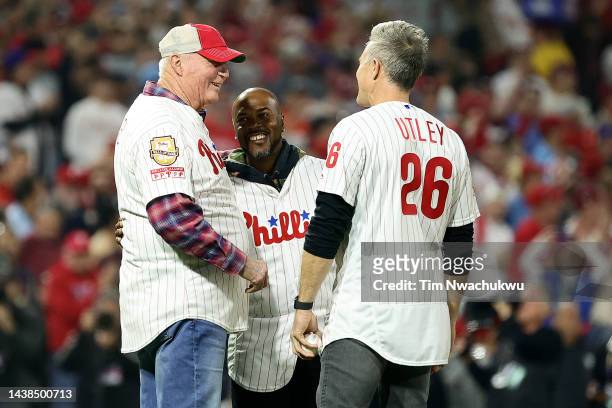 Charlie Manuel, Jimmy Rollins and Chase Utley meet on the field for the first pitch prior to Game Four of the 2022 World Series at Citizens Bank Park...