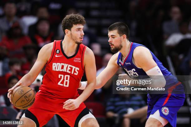 Alperen Sengun of the Houston Rockets battles against Ivica Zubac of the LA Clippers during the first half at Toyota Center on November 02, 2022 in...