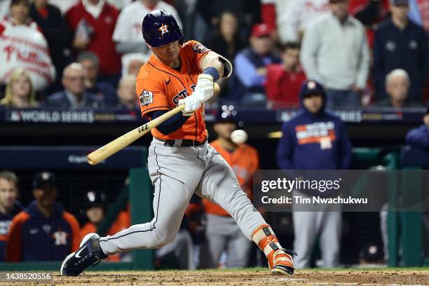 Alex Bregman of the Houston Astros hits a RBI double against the Philadelphia Phillies during the fifth inning in Game Four of the 2022 World Series...