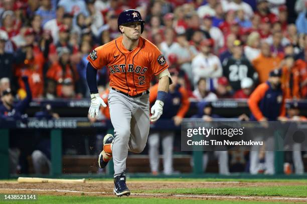 Alex Bregman of the Houston Astros runs to first base after hitting a RBI double against the Philadelphia Phillies during the fifth inning in Game...