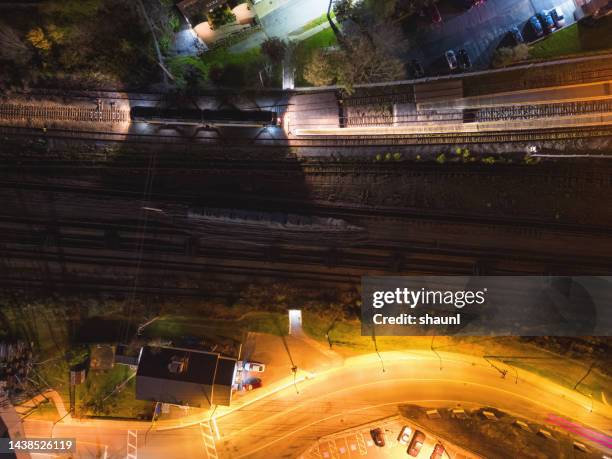 passenger train locomotive - train yard at night stock pictures, royalty-free photos & images
