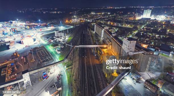 aerial view of port & rail district - train yard at night stock pictures, royalty-free photos & images