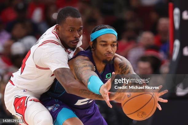 Javonte Green of the Chicago Bulls and P.J. Washington of the Charlotte Hornets fight for a loose ball during the second half at United Center on...