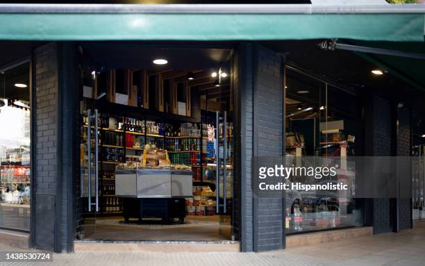 facade of a food store or charcuterie - corner shop stock pictures, royalty-free photos & images